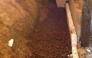 This property had basement flooding issues, excavated behind wall, water proofed and made ready for nova coil drain.